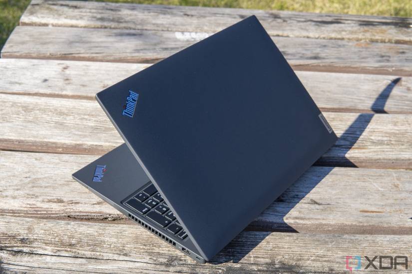 Angled rear view of the Lenovo ThinkPad T16 facing left with the lid open at 45 degrees