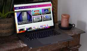 The MacBook Pro M2 Max on a table with the XDA website on the display