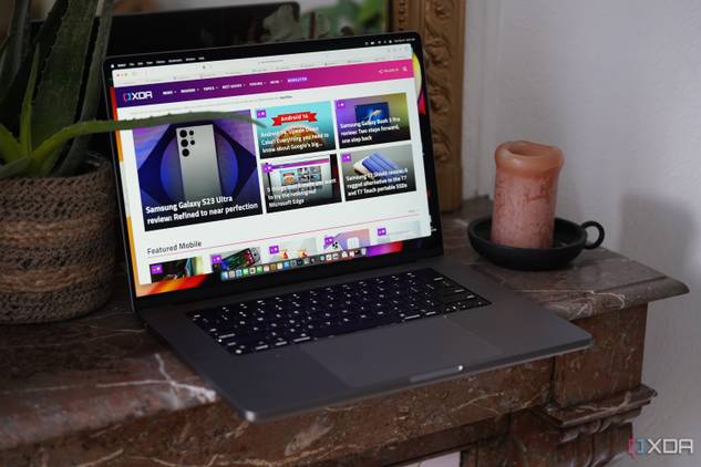 The MacBook Pro M2 Max on a table with the XDA website on the display