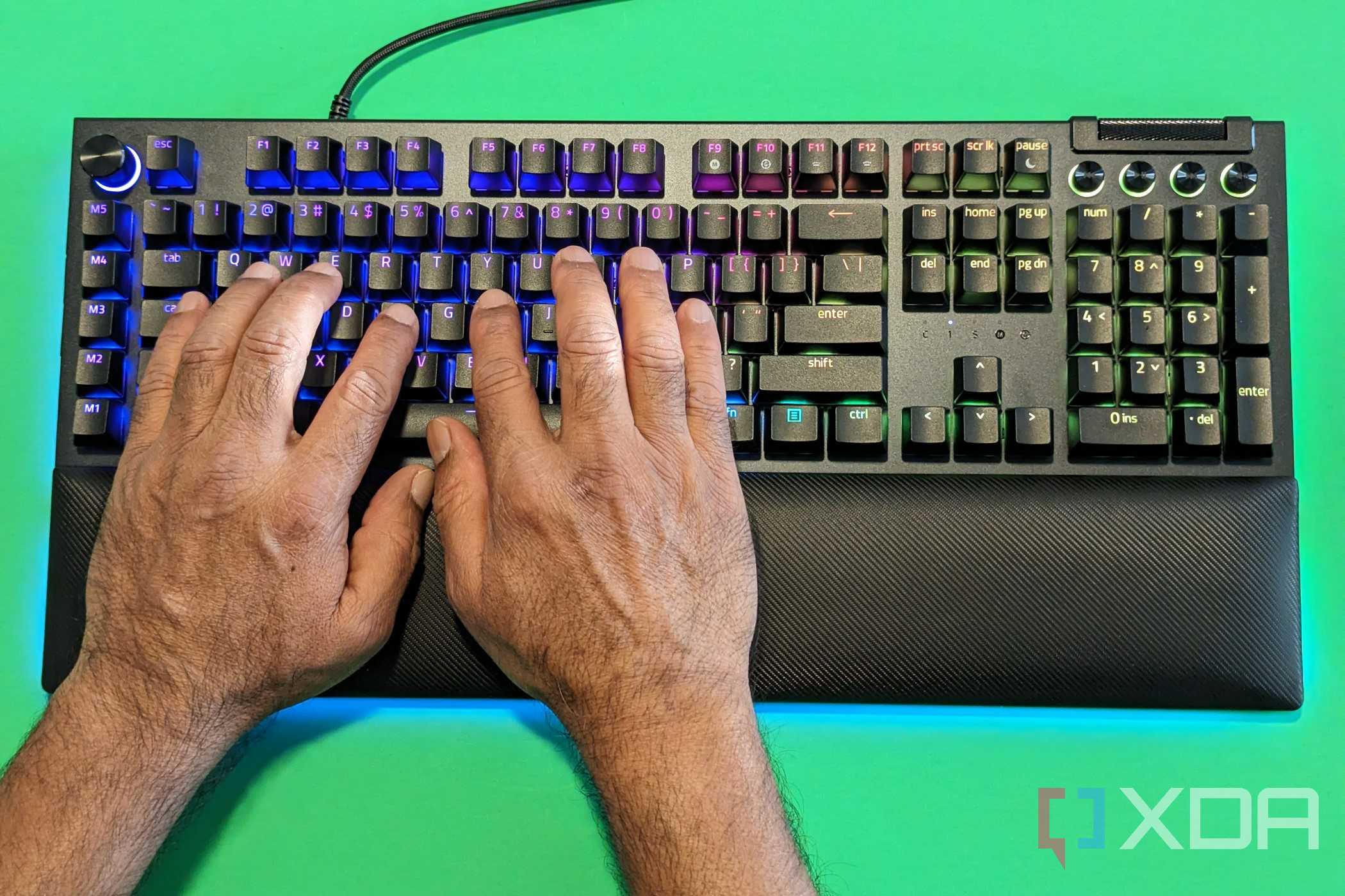 A man with his hands on the Razer Blackwidow V4 Pro Keyboard