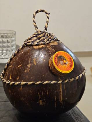 A portrait shot of coconut-shaped wine bottle captured using the Galaxy S23.