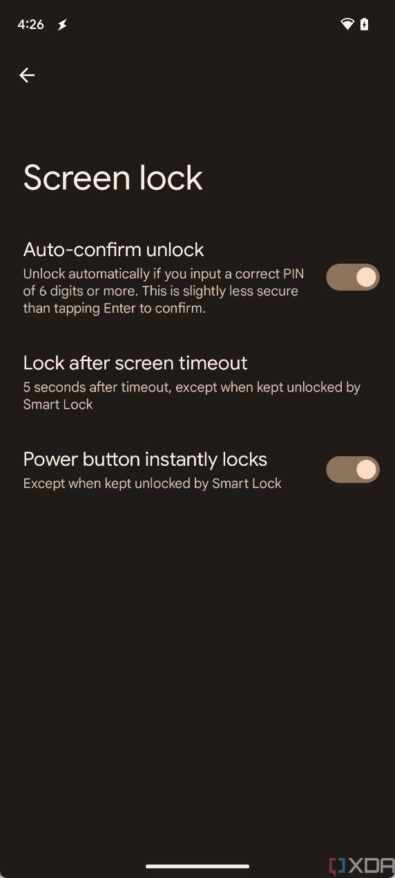 The "auto confirm unlock" option shown in Android 14's security settings