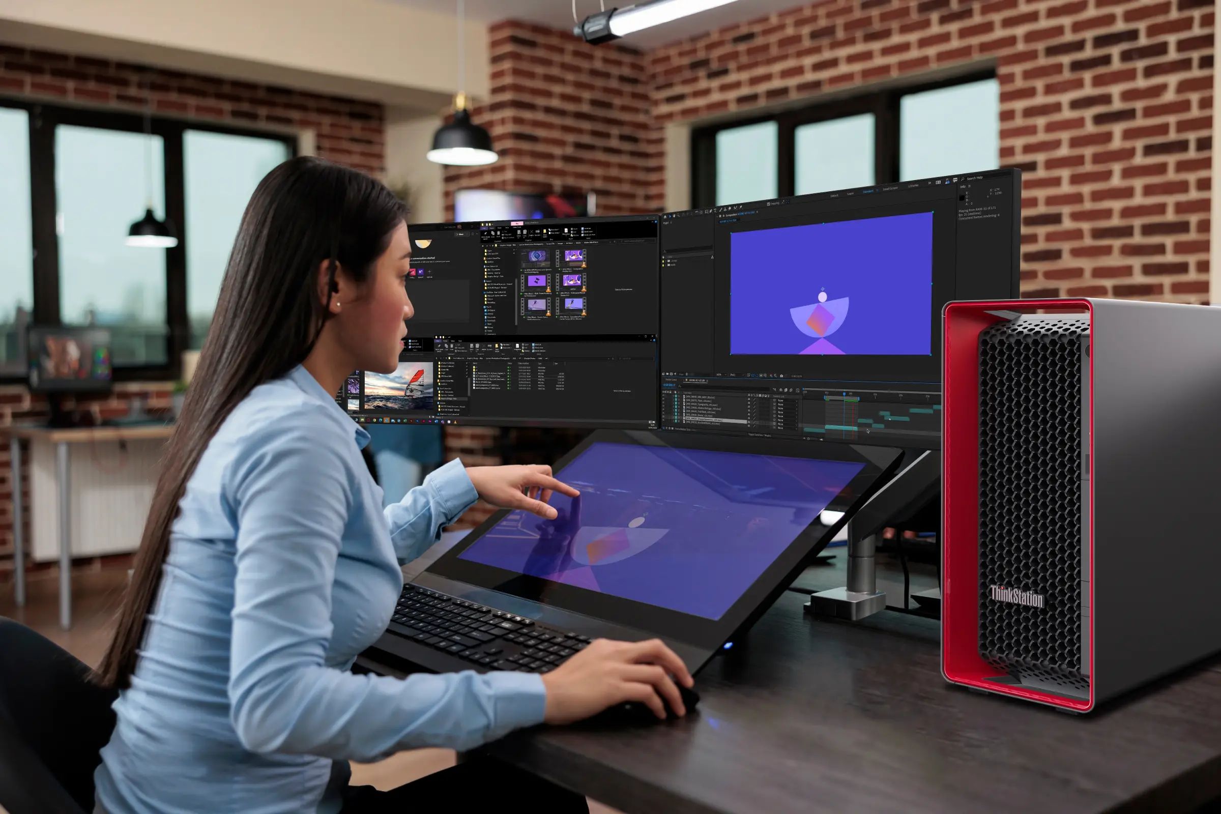 Lenovo ThinkStation P7 on a desk next to multiple monitors