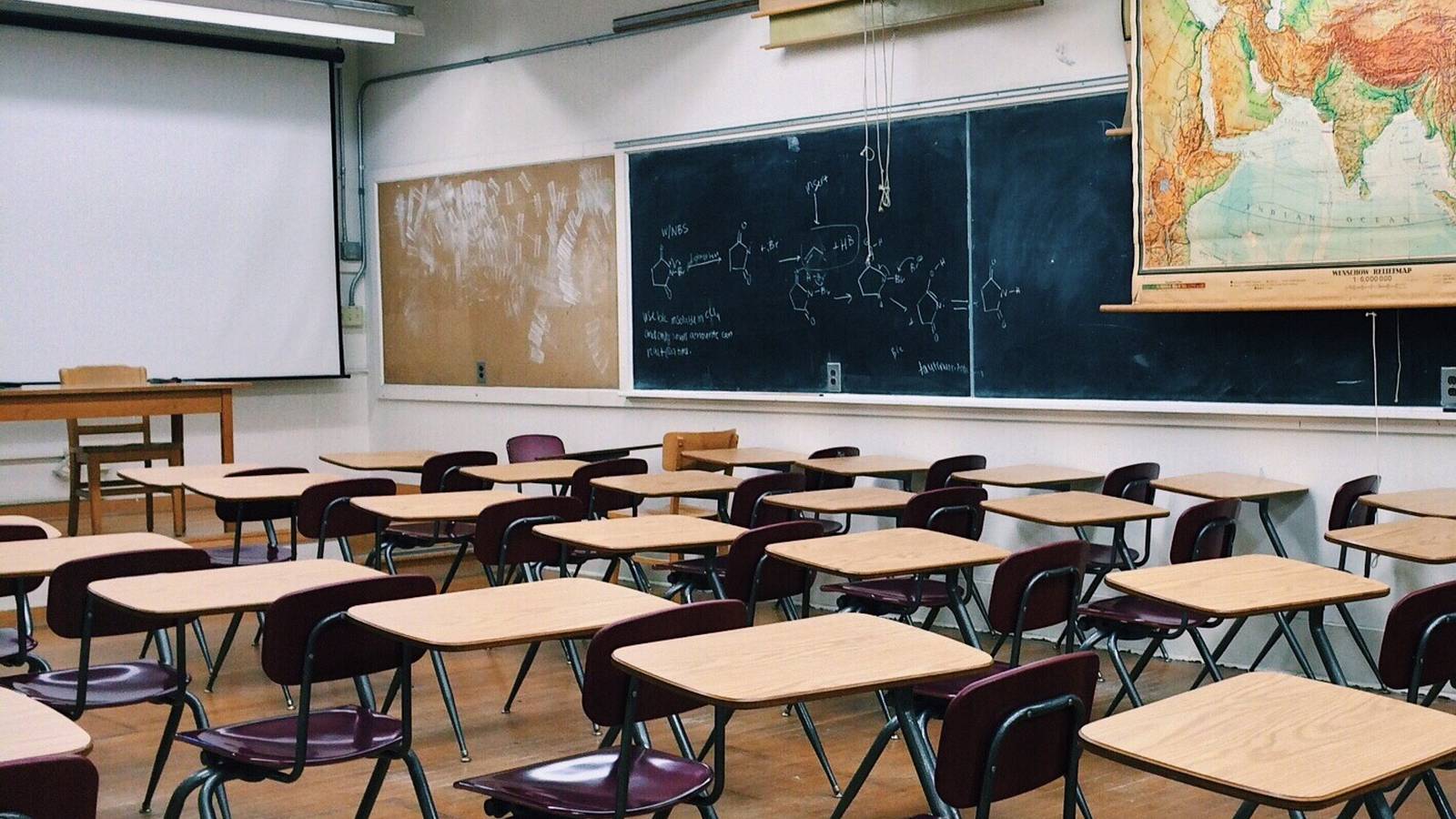 school classroom with chairs and a blackboard