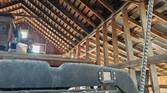 Photo inside of a barn roof rafters