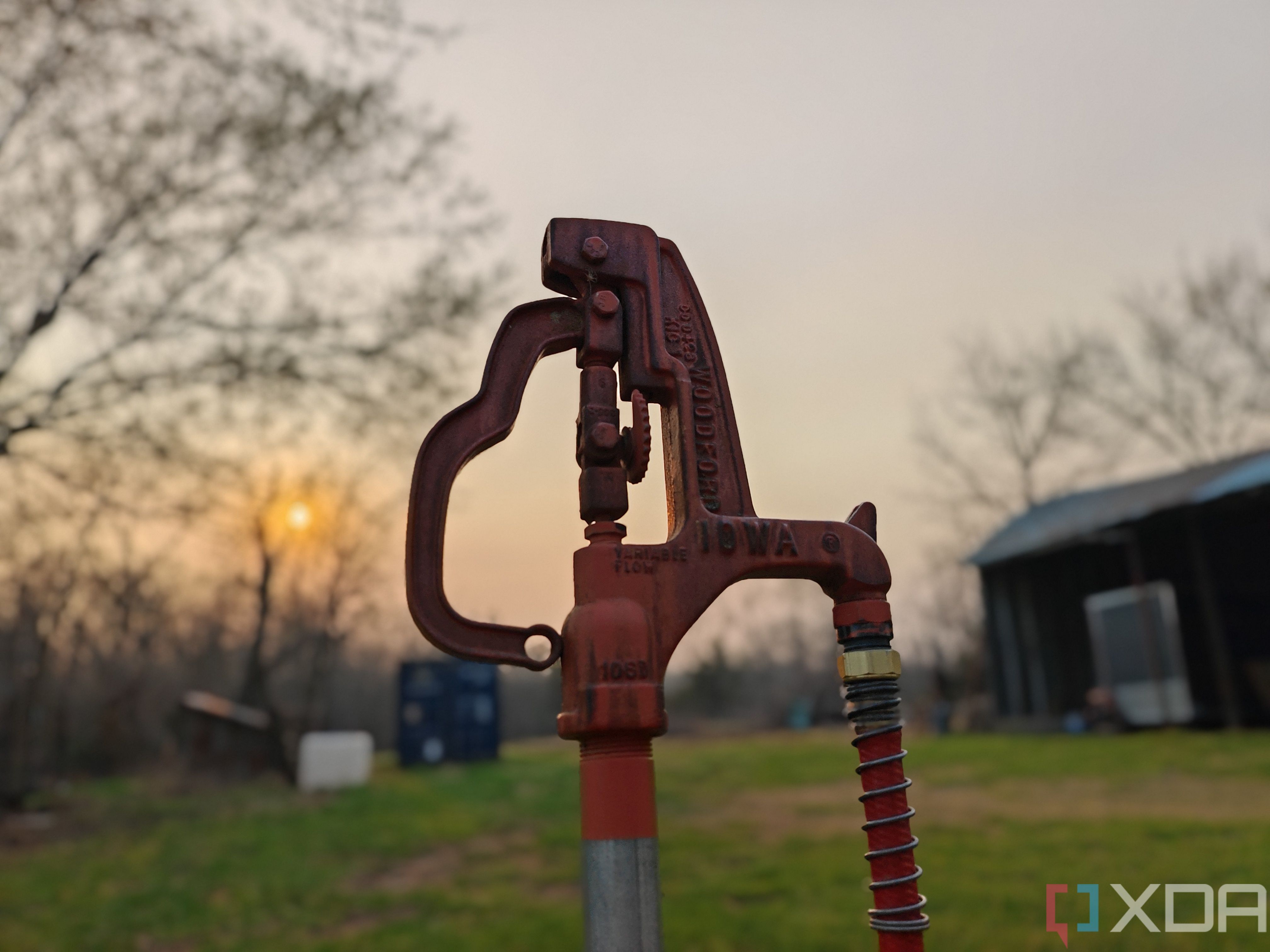 Portrait photo of a water hydrant at sunset with background blur turned on