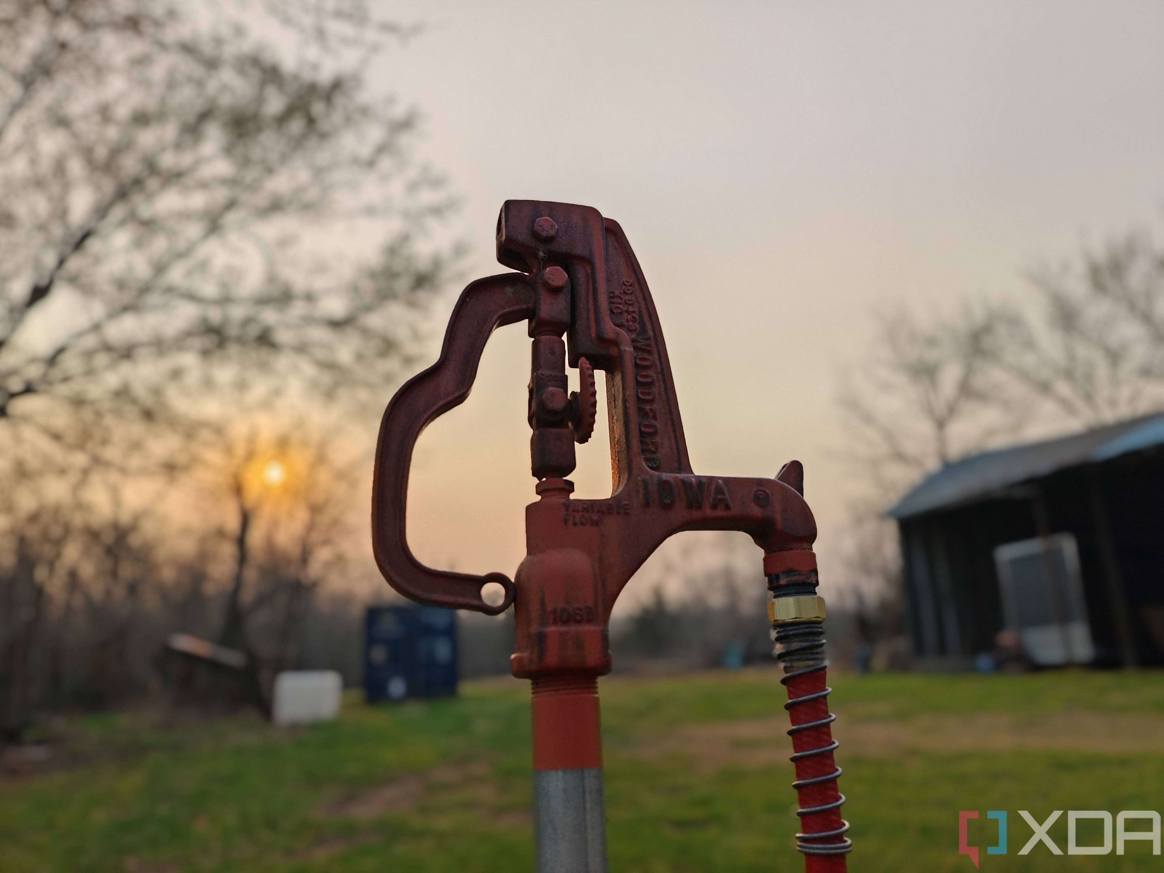 Portrait photo of a water hydrant at sunset with background blur turned on