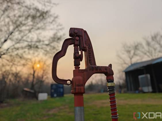 Portrait photo of a water hydrant at sunset with background blur turned on