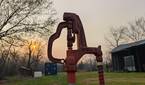 Portrait photo of a water hydrant at sunset with background blur turned off