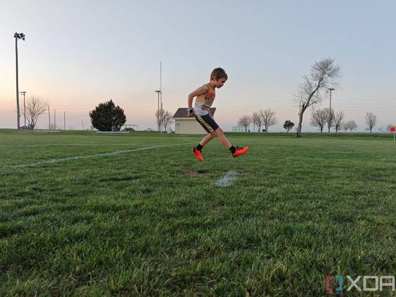 Child playing soccer photo taken using AI Motion Sense