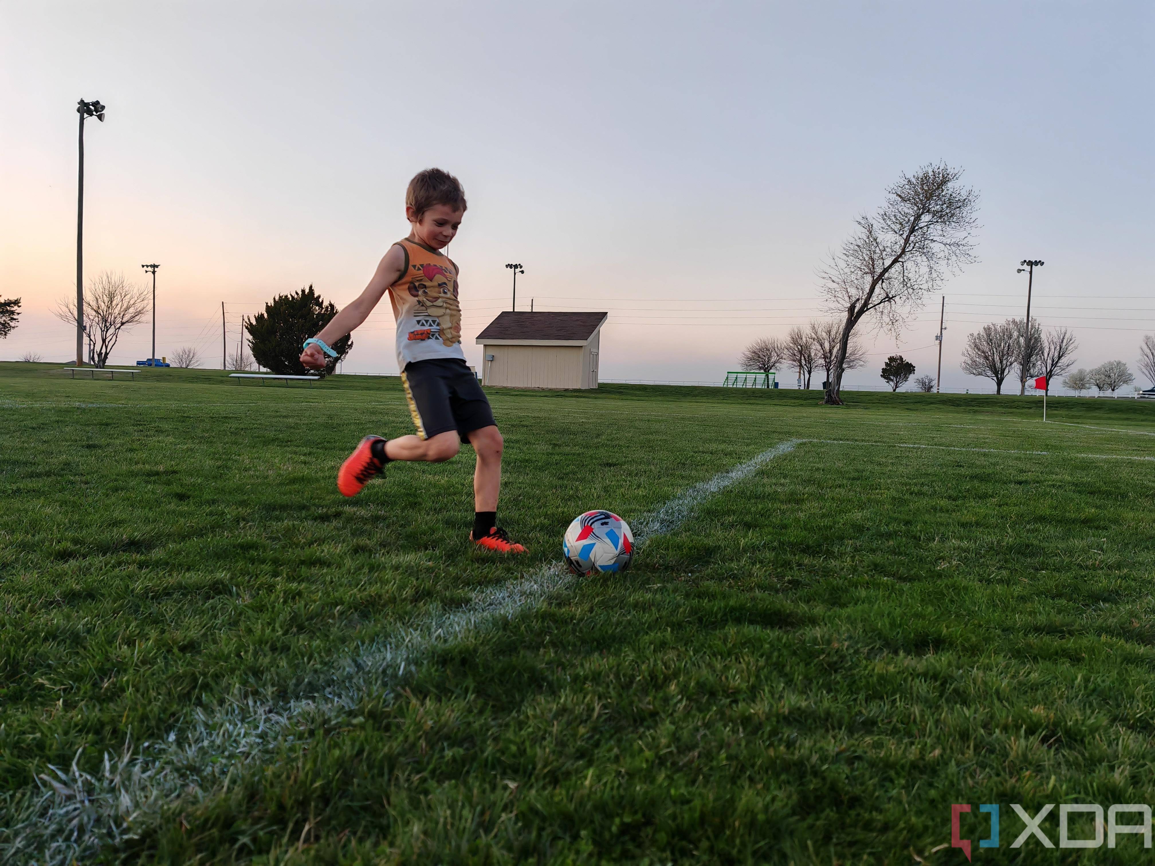 Child playing soccer photo taken using AI Motion Sense