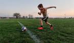 Child playing soccer photo taken using AI Motion Sense