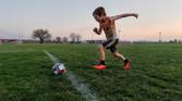 Child playing soccer photo taken using AI Motion Sense