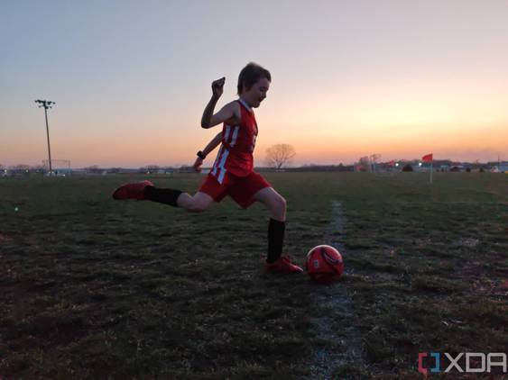 Child playing soccer photo taken using manual shutter