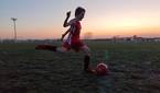 Child playing soccer photo taken using manual shutter