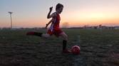 Child playing soccer photo taken using manual shutter