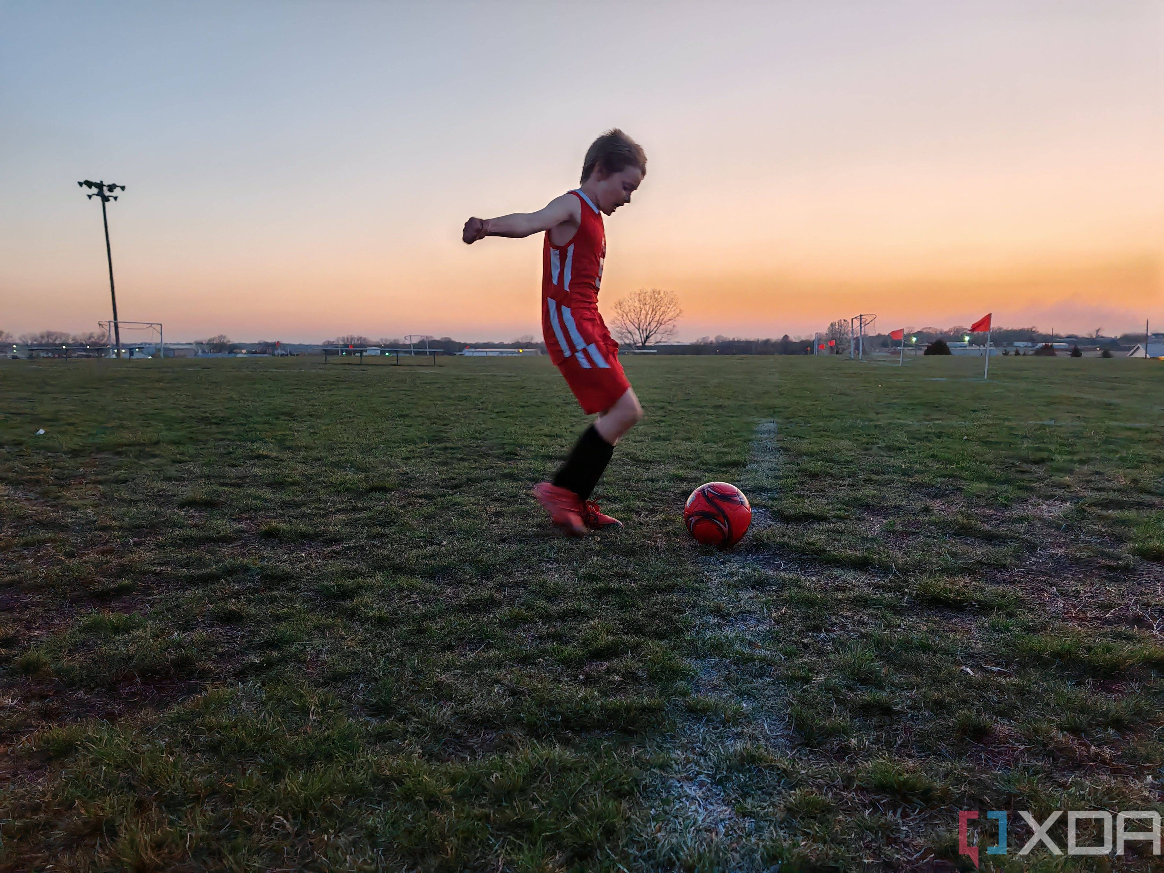 Child playing soccer photo taken using AI Motion Sense