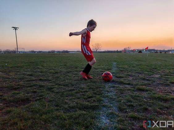 Child playing soccer photo taken using AI Motion Sense