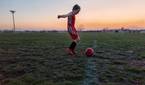 Child playing soccer photo taken using AI Motion Sense