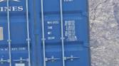 Outdoor photo of a barn and shipping container at 30x zoom