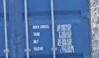 Outdoor photo of a barn and shipping container at 50x zoom