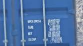 Outdoor photo of a barn and shipping container at 50x zoom