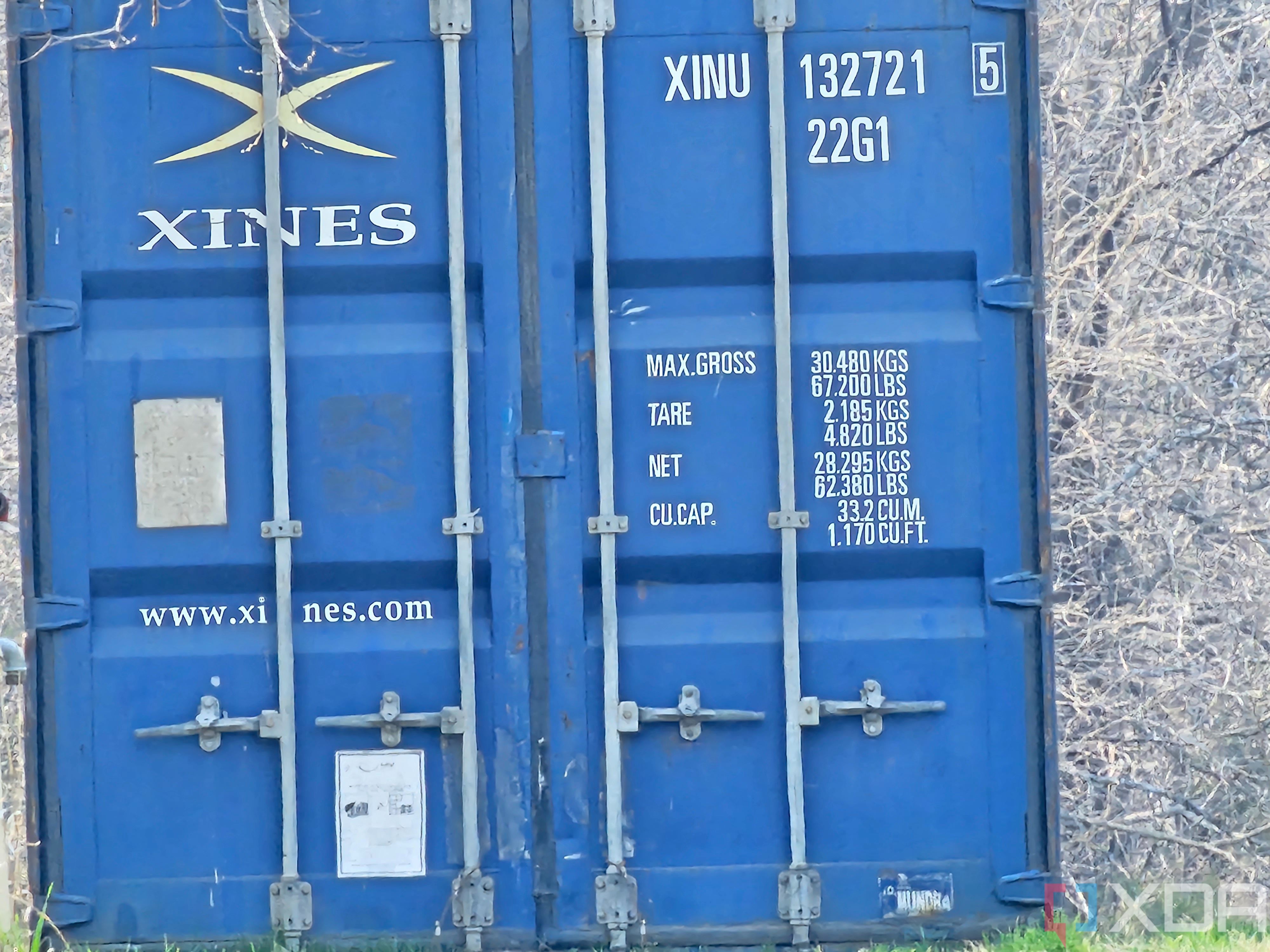 Photo of a barn and shipping container at 30x zoom