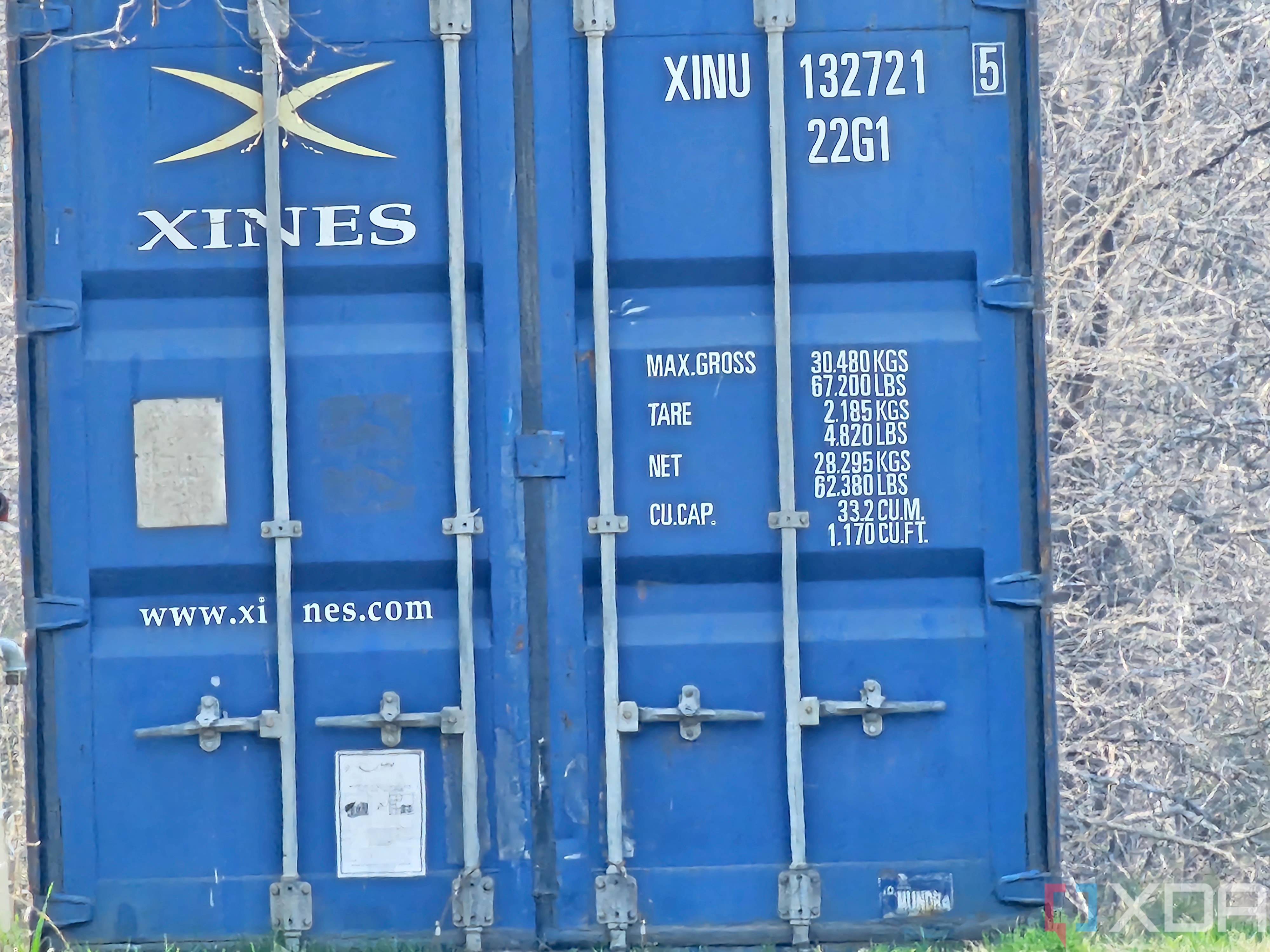 Photo of a barn and shipping container at 30x zoom