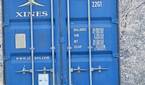Photo of a barn and shipping container at 30x zoom