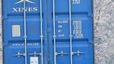 Photo of a barn and shipping container at 30x zoom