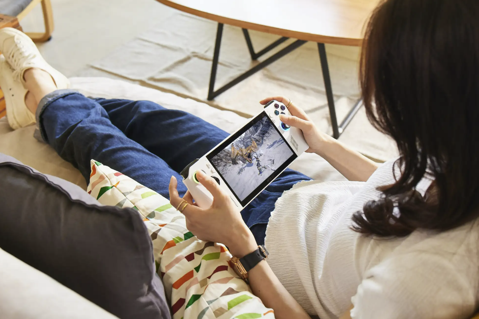 A woman playing a Monster Hunter game on the Asus ROG Ally