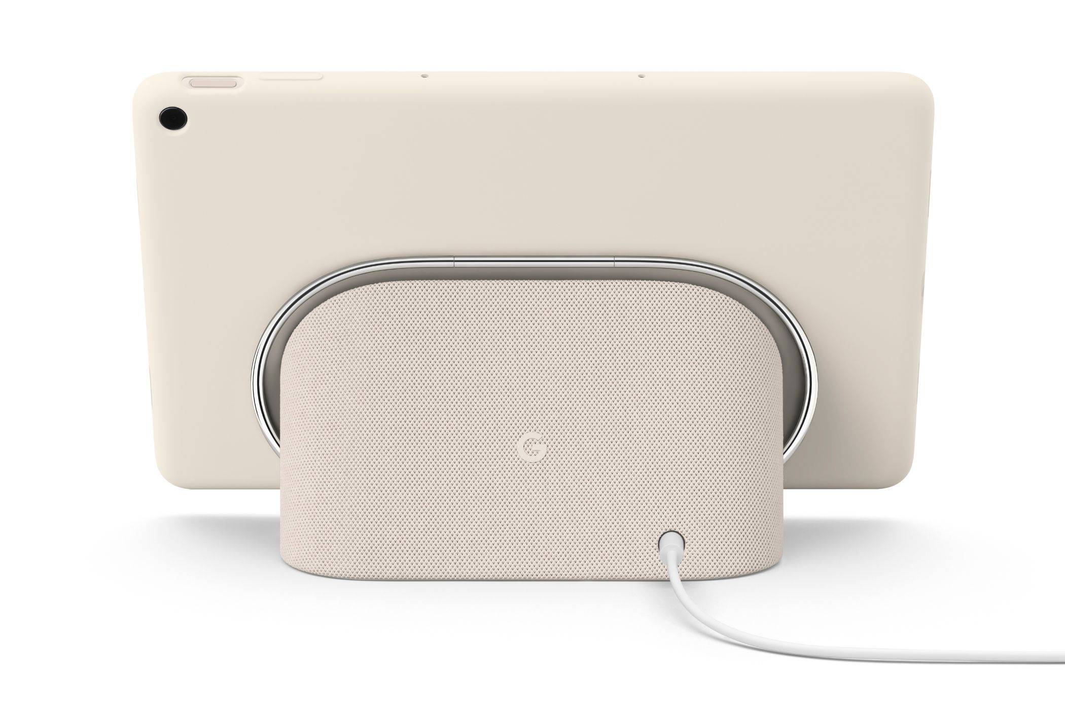A render showing a Pixel Tablet in Porcelain color docked on the included accessory.