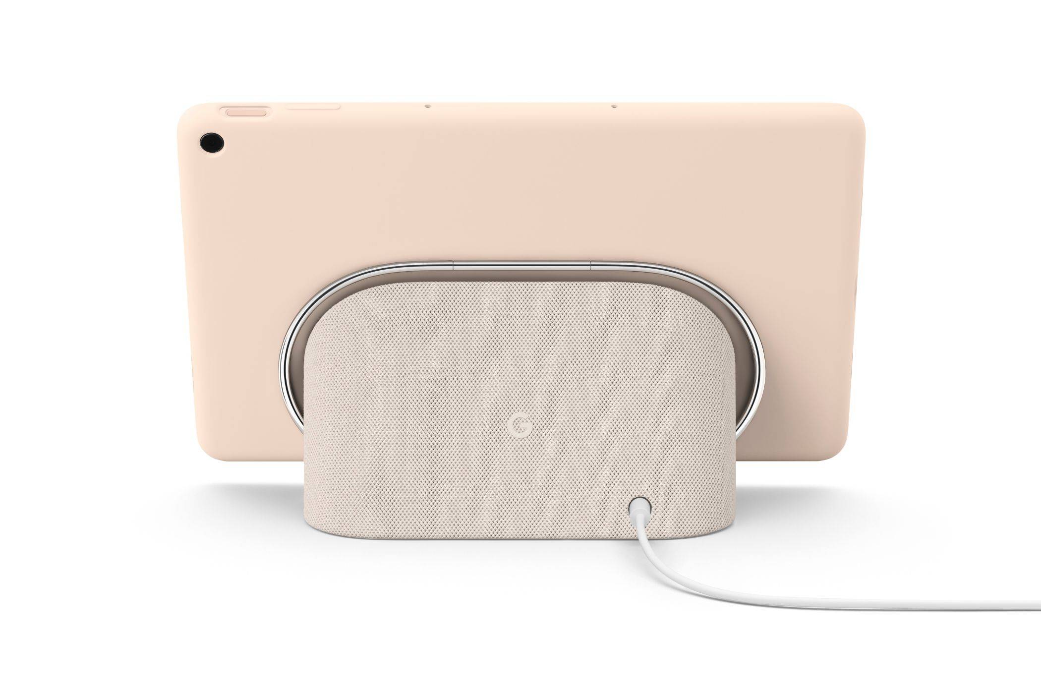 A render showing a Pixel Tablet in rose color docked on the included charging speaker dock.