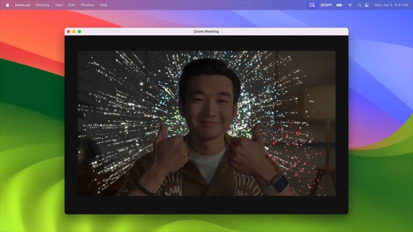 Screenshot of macOS Sonoma displaying a fireworks animations when the user on camera makes a two-thumps gesture