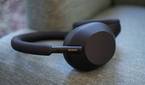 Sony WH-1000XM5 headphones on a sofa