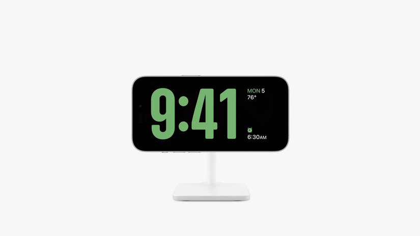 Standby displaying time with large numbers on a white stand with a white background