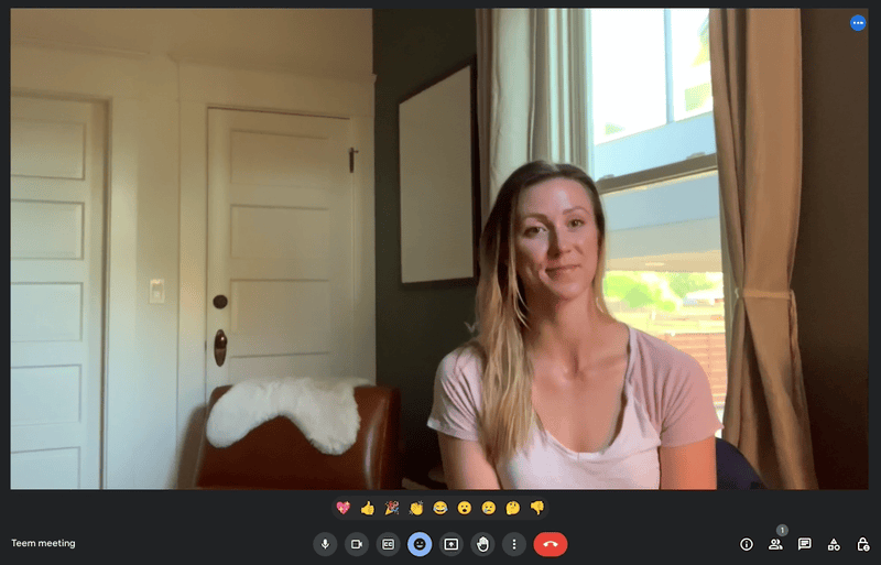 A woman on Google Meet for web using new menu system 