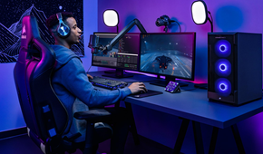 Person playing games on a PC while using Elgato streaming accessories.