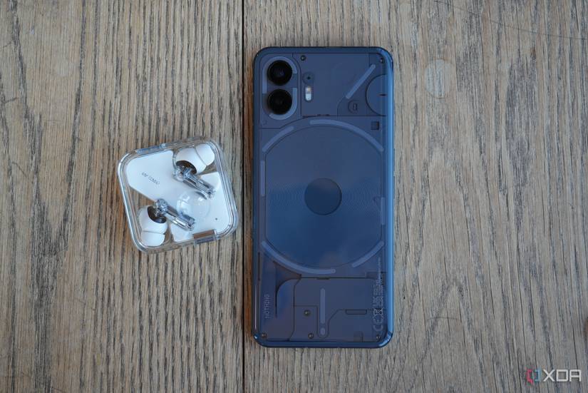 The Nothing Phone 2 with the Nothing Ear 2 on a table top. 