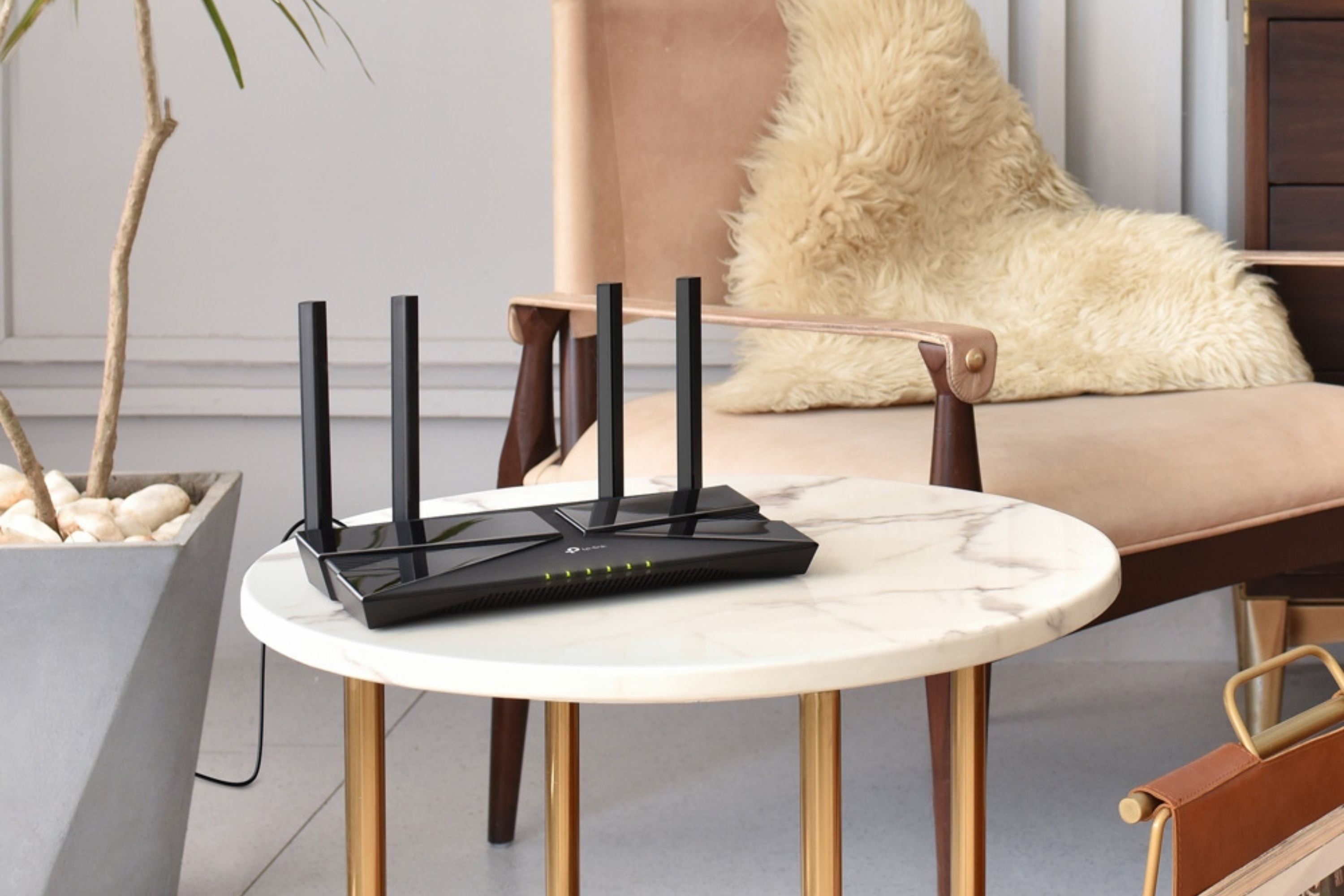 TP-Link AX1800 WiFi 6 Router on a marble table with furs in the background