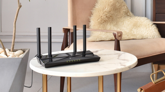 TP-Link AX1800 WiFi 6 Router on a marble table with furs in the background