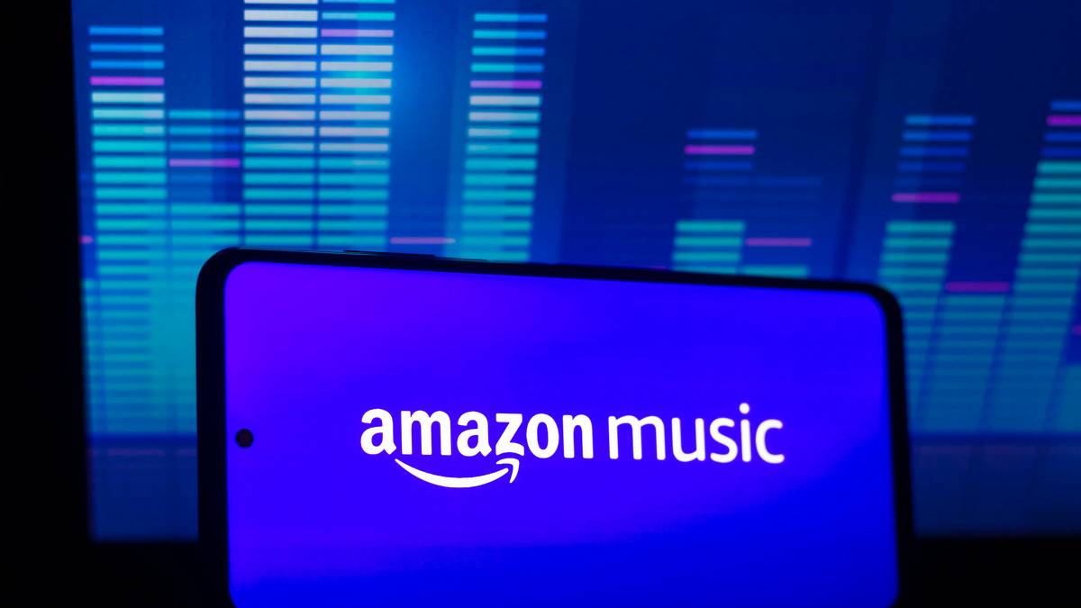 A smartphone in landscape mode with Amazon Music written in black on electric blue background