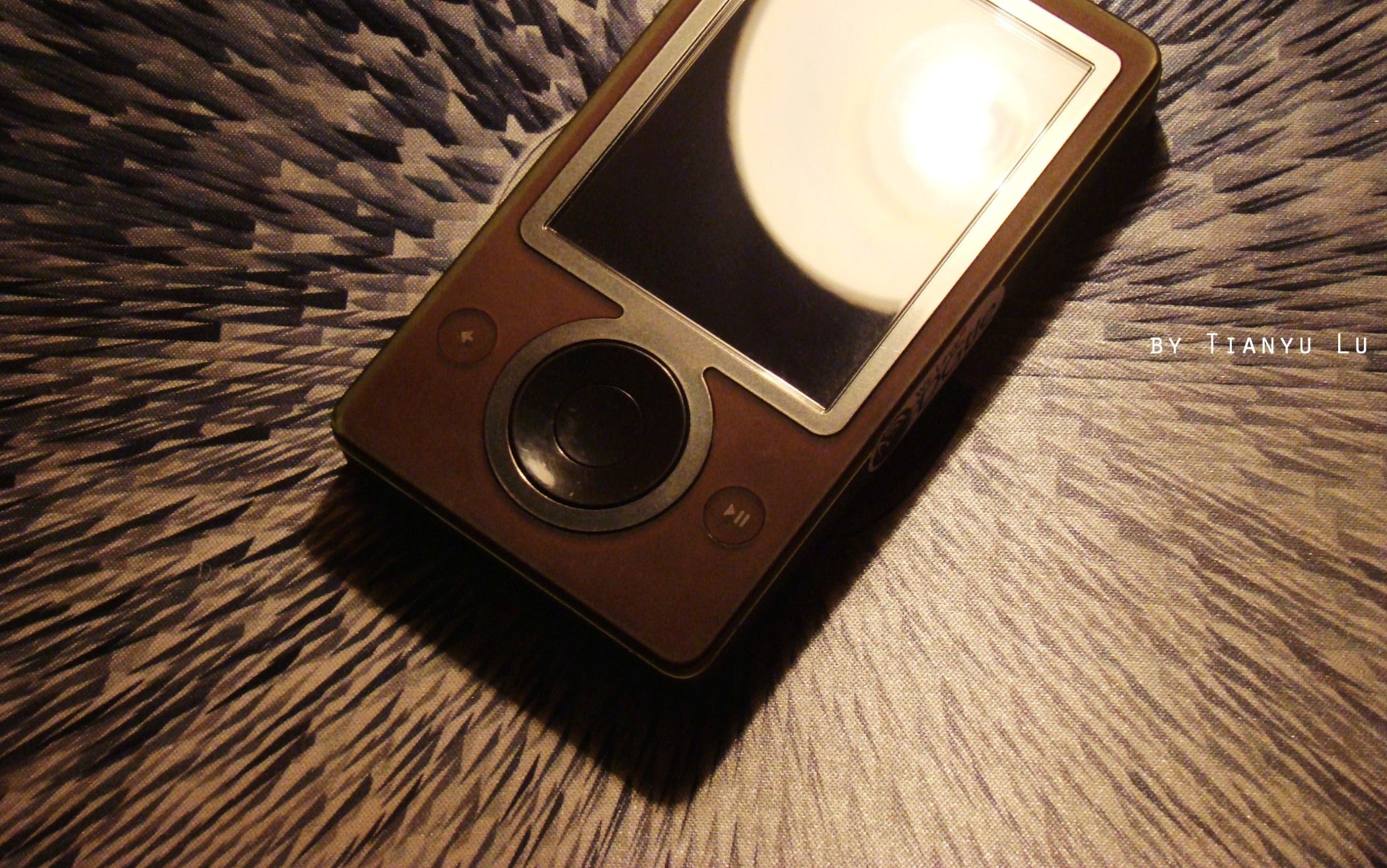 Close up of Microsoft Zune brown color on a textured surface