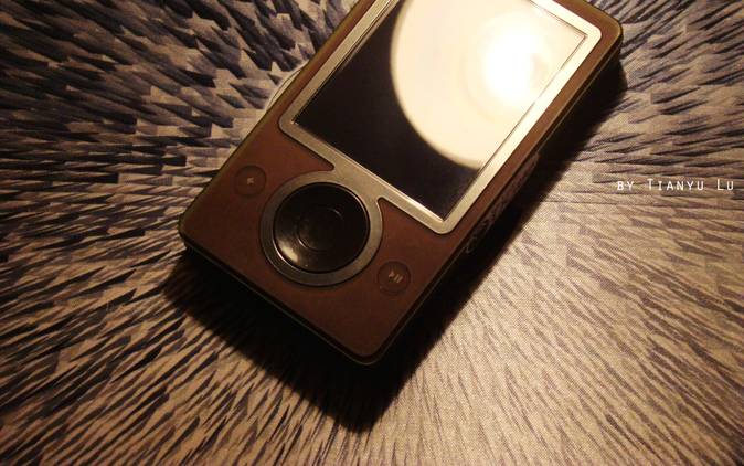 Close up of Microsoft Zune brown color on a textured surface