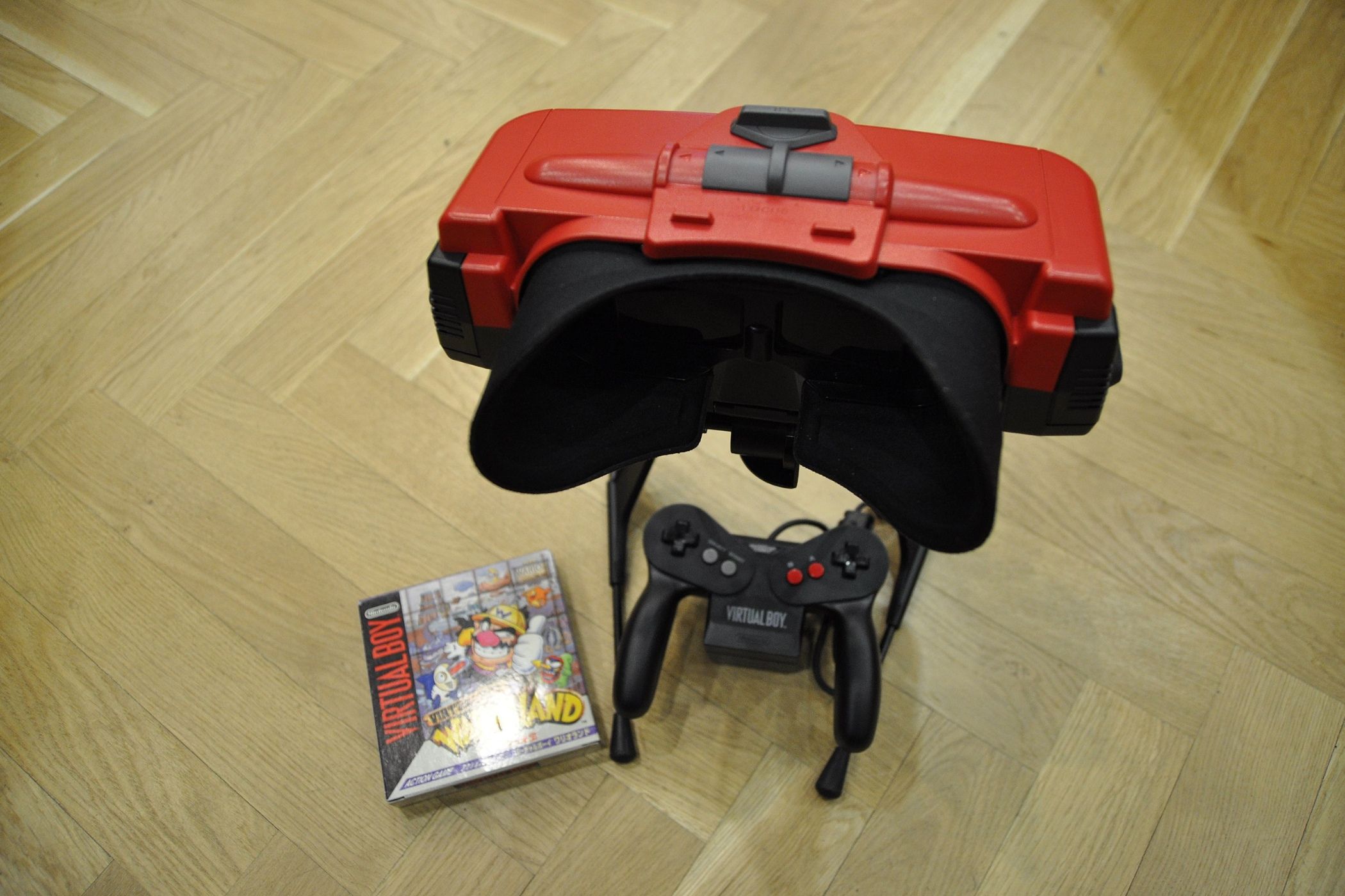 Nintendo Virtual Boy with a game box on the floor