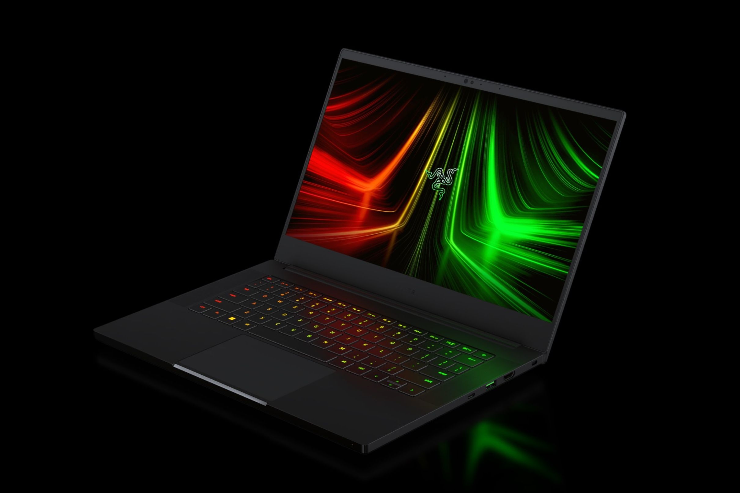 An image of the Razer Blade 14 (2023) with its RGB backlit keyboard