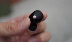 The Sony XM5 earbuds in the hand