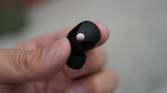 The Sony XM5 earbuds in the hand