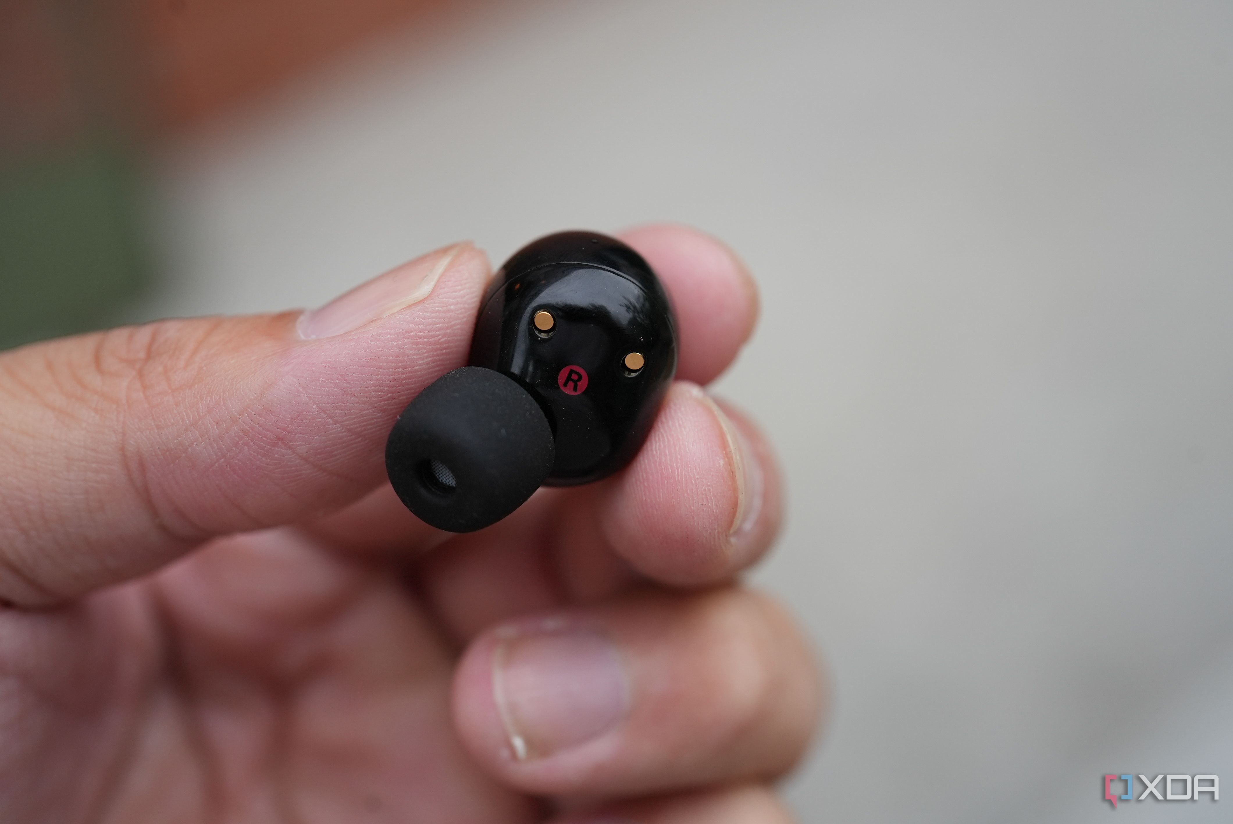 sony XM5 earbuds in the hand 