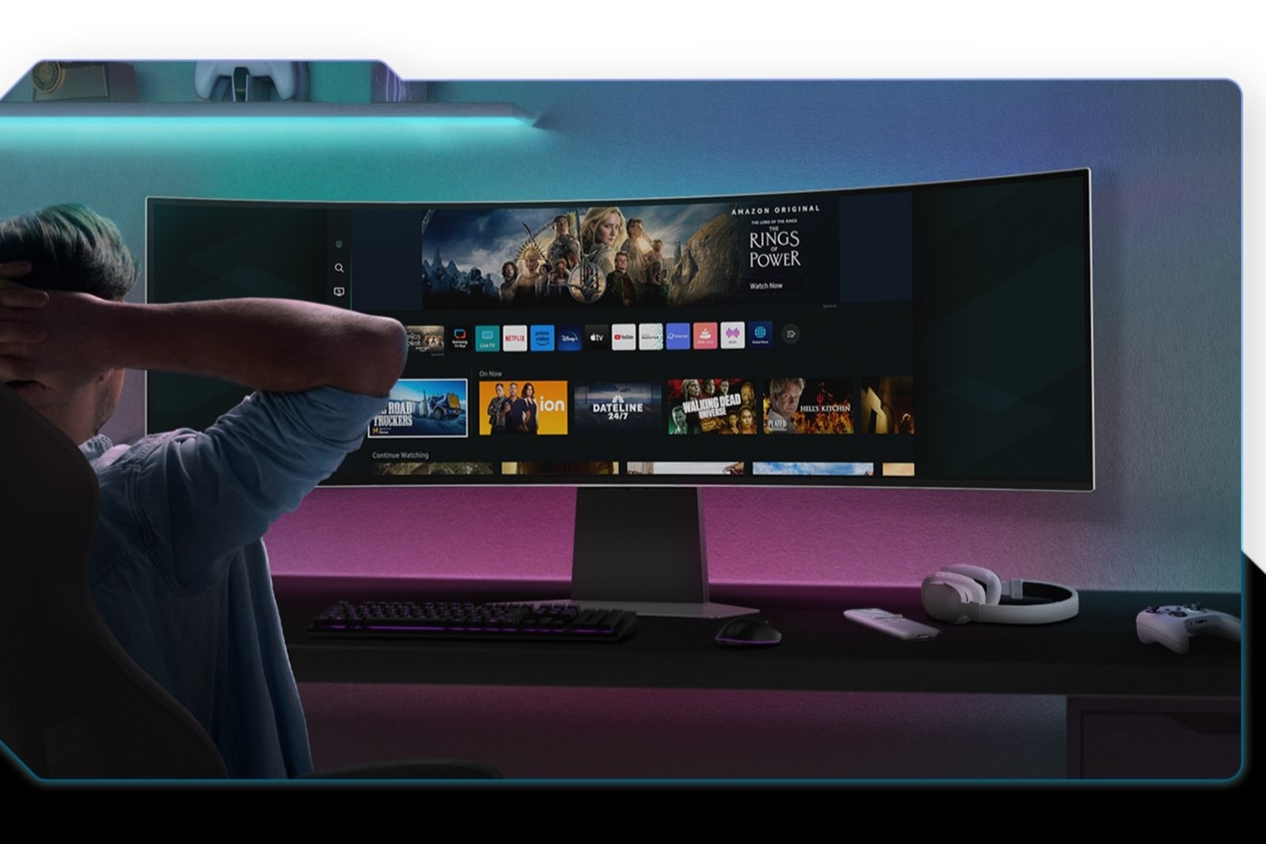 Person sitting in front of Samsung Odyssey G9 49-inch OLED monitor